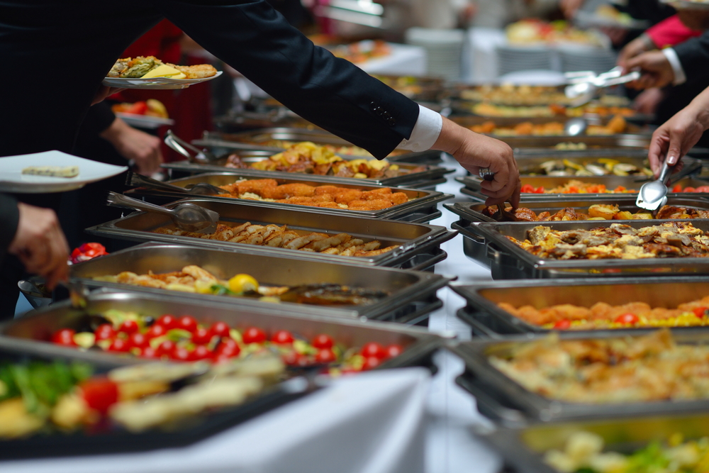 people group catering buffet food indoor in luxury restaurant with meat colorful fruits and vegetables